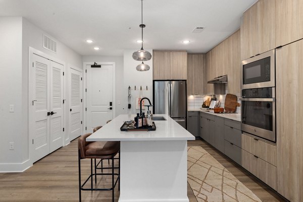 Modern kitchen featuring stainless steel appliances at The Point Apartments