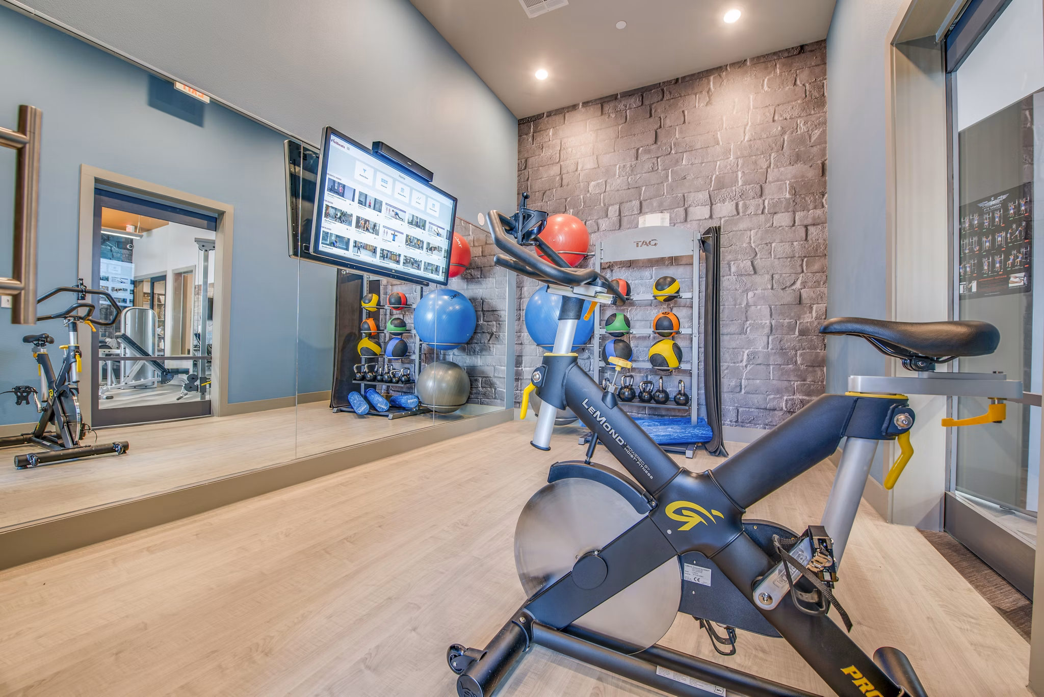 Modern yoga/spin studio with state-of-the-art equipment at Bellrock Upper North Apartments