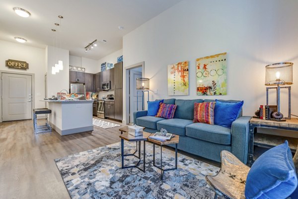 Spacious living room with modern decor and natural light at Bellrock Upper North Apartments