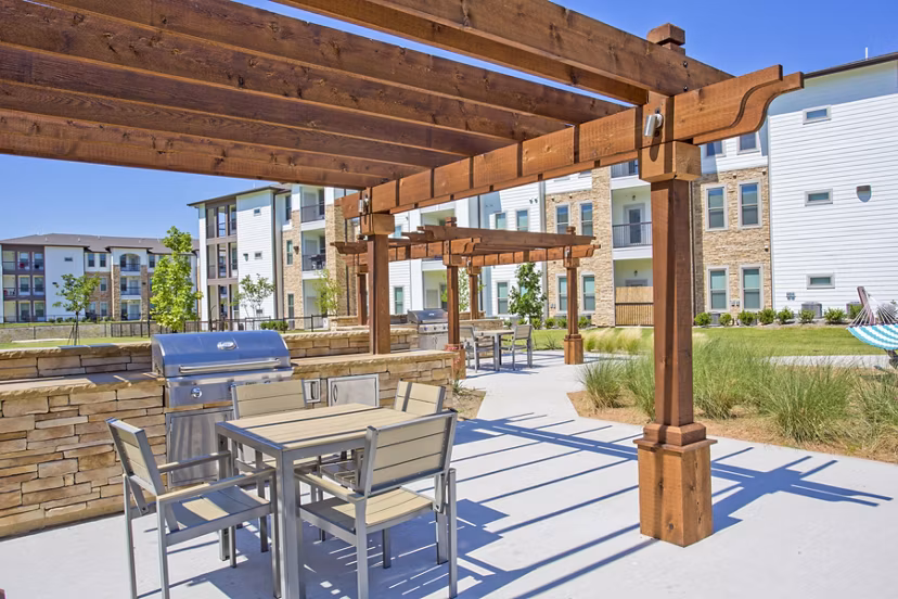 Modern grill area and patio at Bellrock Upper North Apartments, perfect for outdoor dining and socializing