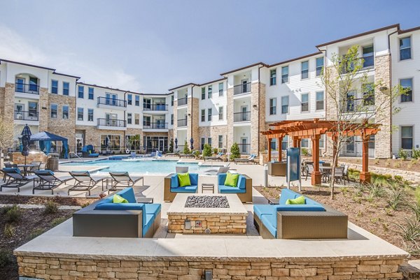 Cozy fire pit on a stylish patio at Bellrock Upper North Apartments