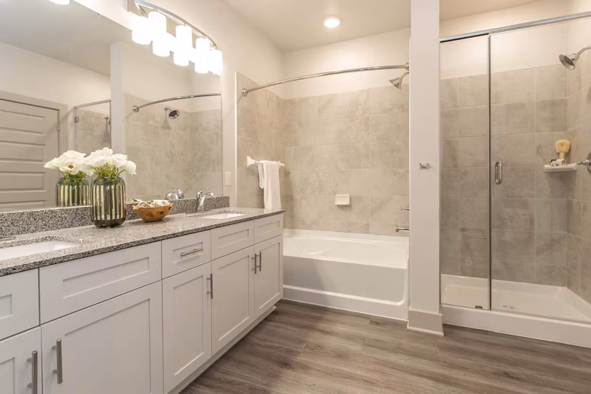 Bathroom featuring sleek fixtures and modern design at Vibe Med Center Apartments