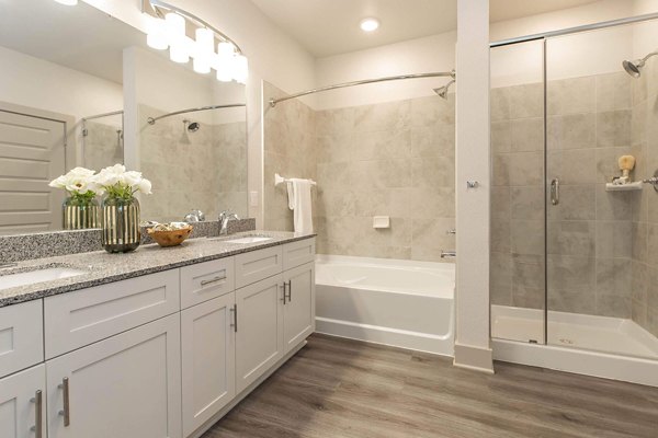 Bathroom featuring sleek fixtures and modern design at Vibe Med Center Apartments