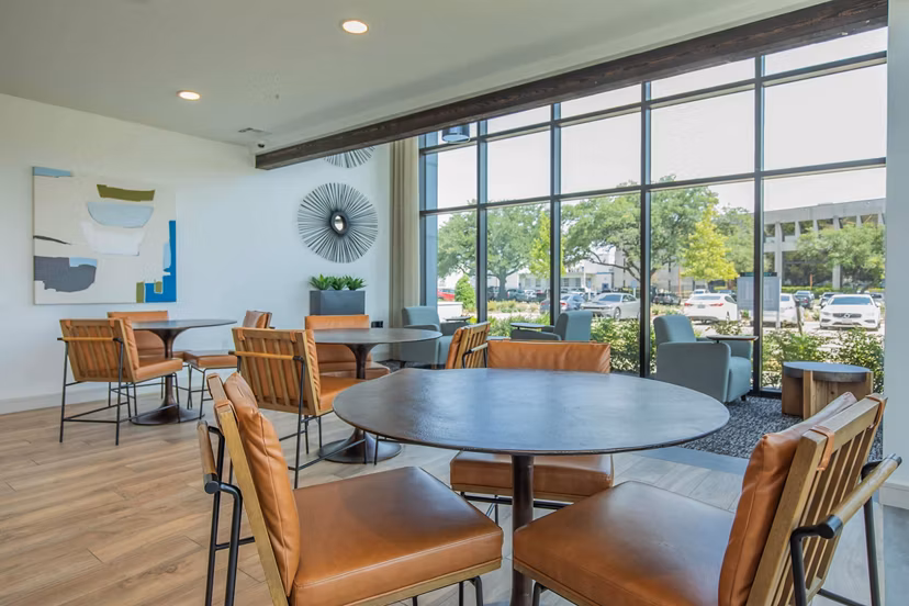Contemporary clubhouse at Vibe Med Center Apartments with modern seating and entertainment areas in Houston