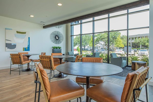 Contemporary clubhouse at Vibe Med Center Apartments with modern seating and entertainment areas in Houston