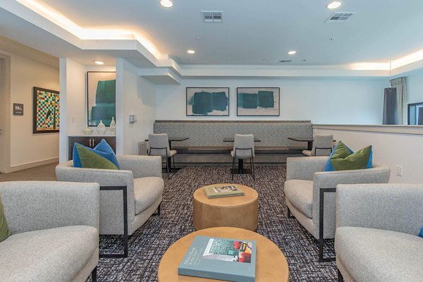 Elegant clubhouse with modern decor at Vibe Med Center Apartments featuring luxurious social spaces and facilities for residents