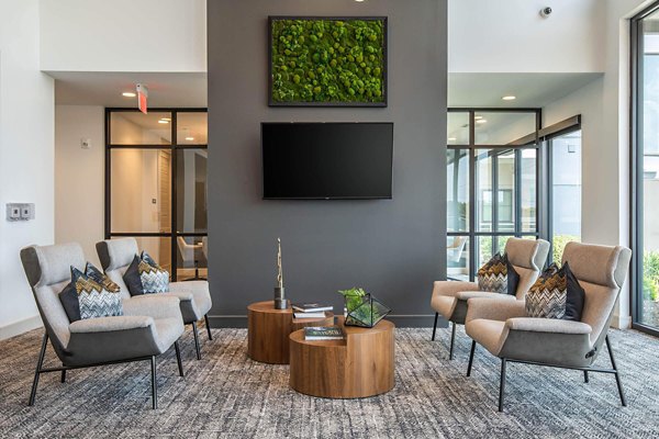 Clubhouse featuring modern decor and entertainment areas at Vibe Med Center Apartments