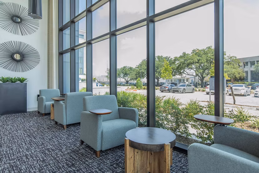 Clubhouse with modern furnishings and design at Vibe Med Center Apartments, offering upscale spaces for gatherings and relaxation