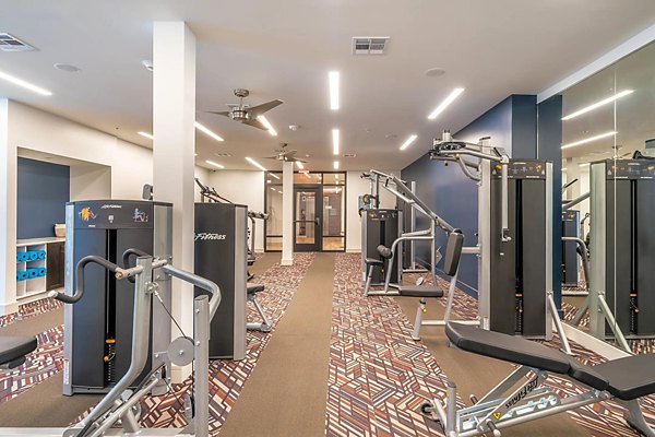 State-of-the-art fitness center with modern equipment at Vibe Med Center Apartments