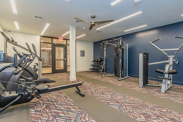 Modern fitness center with advanced equipment at Vibe Med Center Apartments