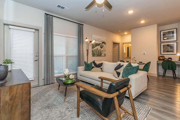 Spacious living room with modern decor at Vibe Med Center Apartments