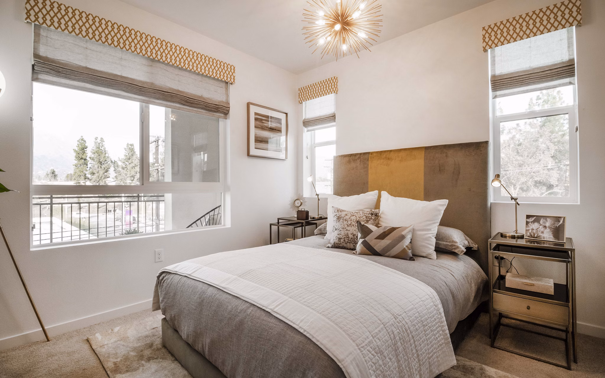 Cozy bedroom with modern design elements at MODA at Monrovia Station Apartments, featuring luxury decor and spacious sleeping area