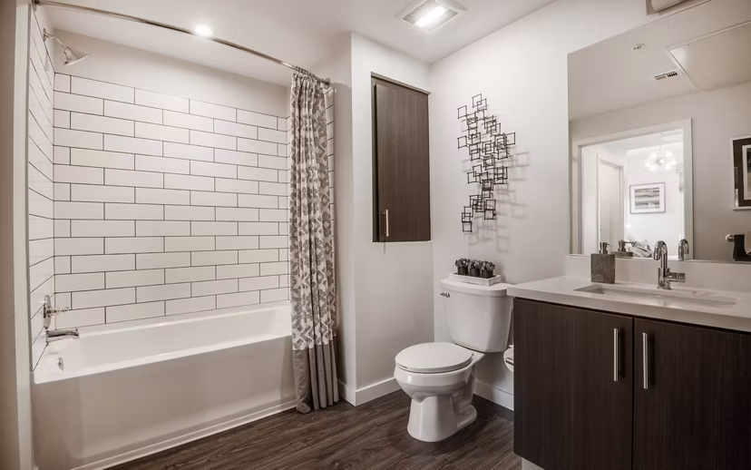 Bathroom with modern fixtures and elegant finishes at MODA at Monrovia Station Apartments