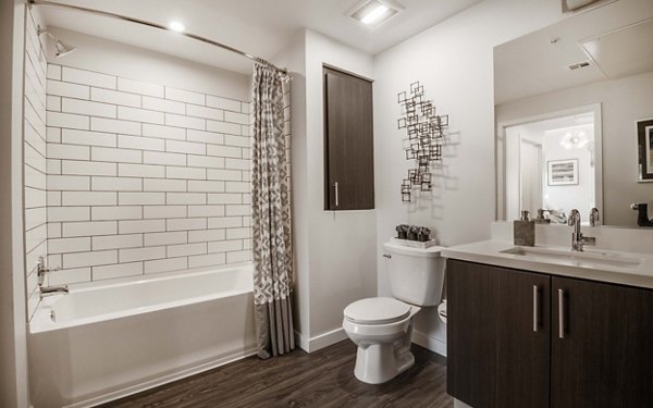 Bathroom with modern fixtures and elegant finishes at MODA at Monrovia Station Apartments