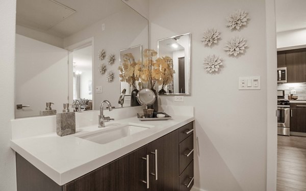 Modern bathroom with elegant fixtures in MODA at Monrovia Station Apartments