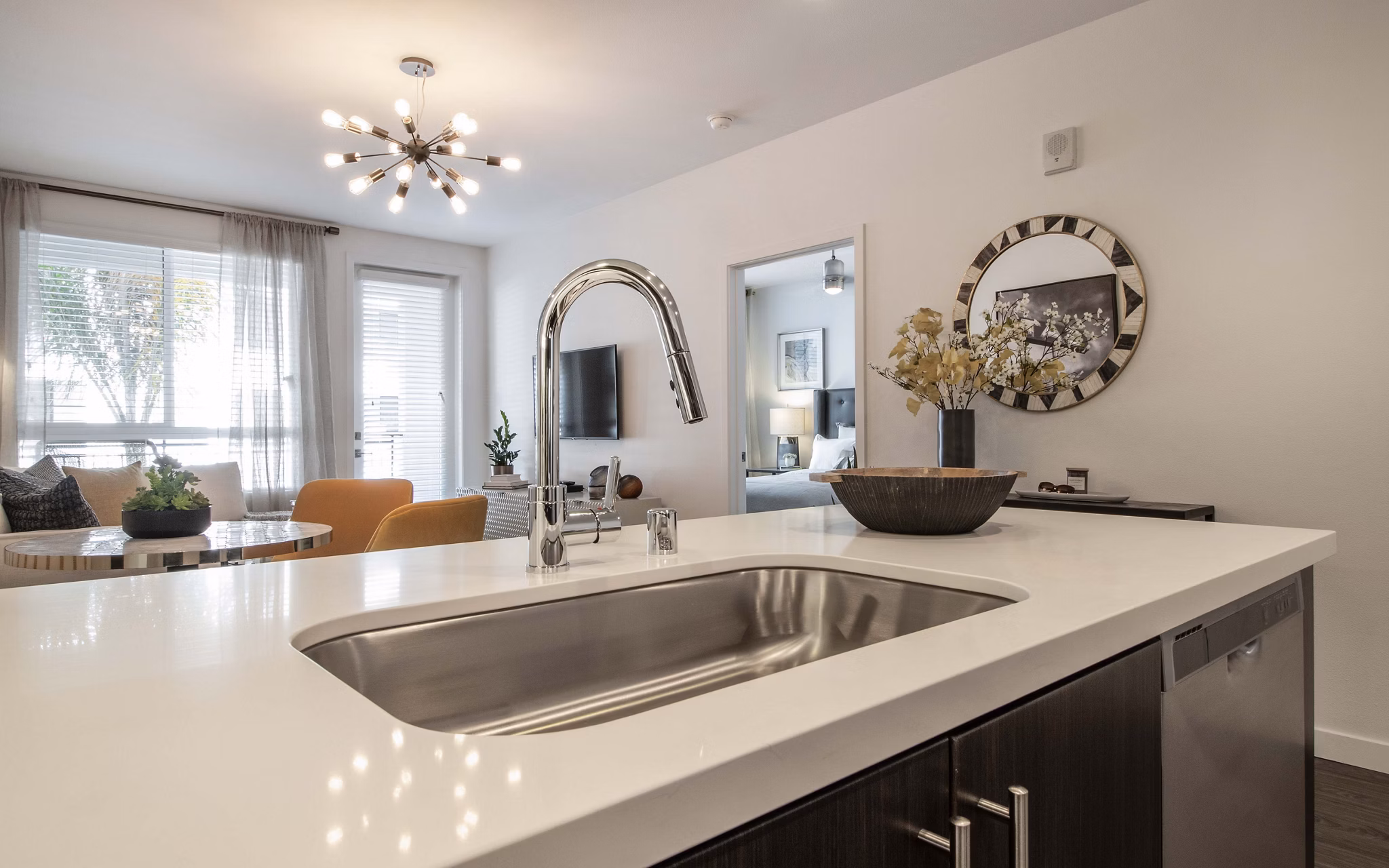 Modern kitchen with stainless steel appliances at MODA at Monrovia Station Apartments