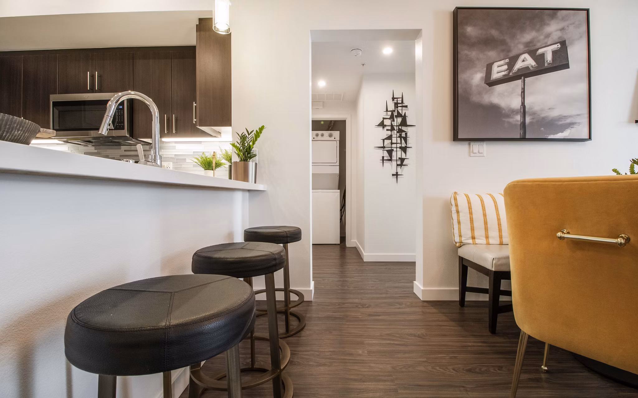 Modern kitchen with stainless steel appliances at MODA at Monrovia Station Apartments