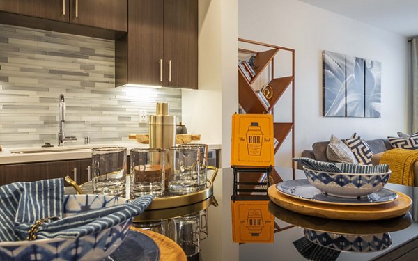 Modern kitchen with stainless steel appliances at MODA at Monrovia Station Apartments