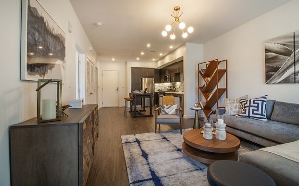 Modern living room with chic furnishings at MODA at Monrovia Station Apartments, spacious design perfect for relaxation and entertaining