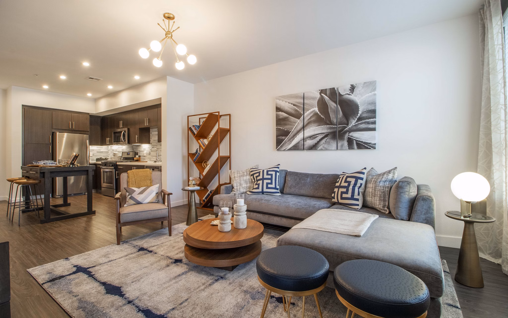 Modern living room with sleek furniture and natural light at MODA at Monrovia Station Apartments