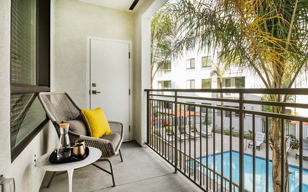 Patio with stylish seating and lush greenery at MODA at Monrovia Station Apartments