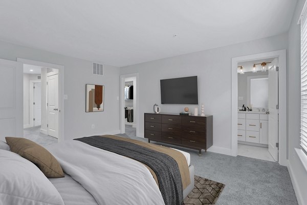 Cozy bedroom with modern decor and soft lighting at Brookestone Townhomes