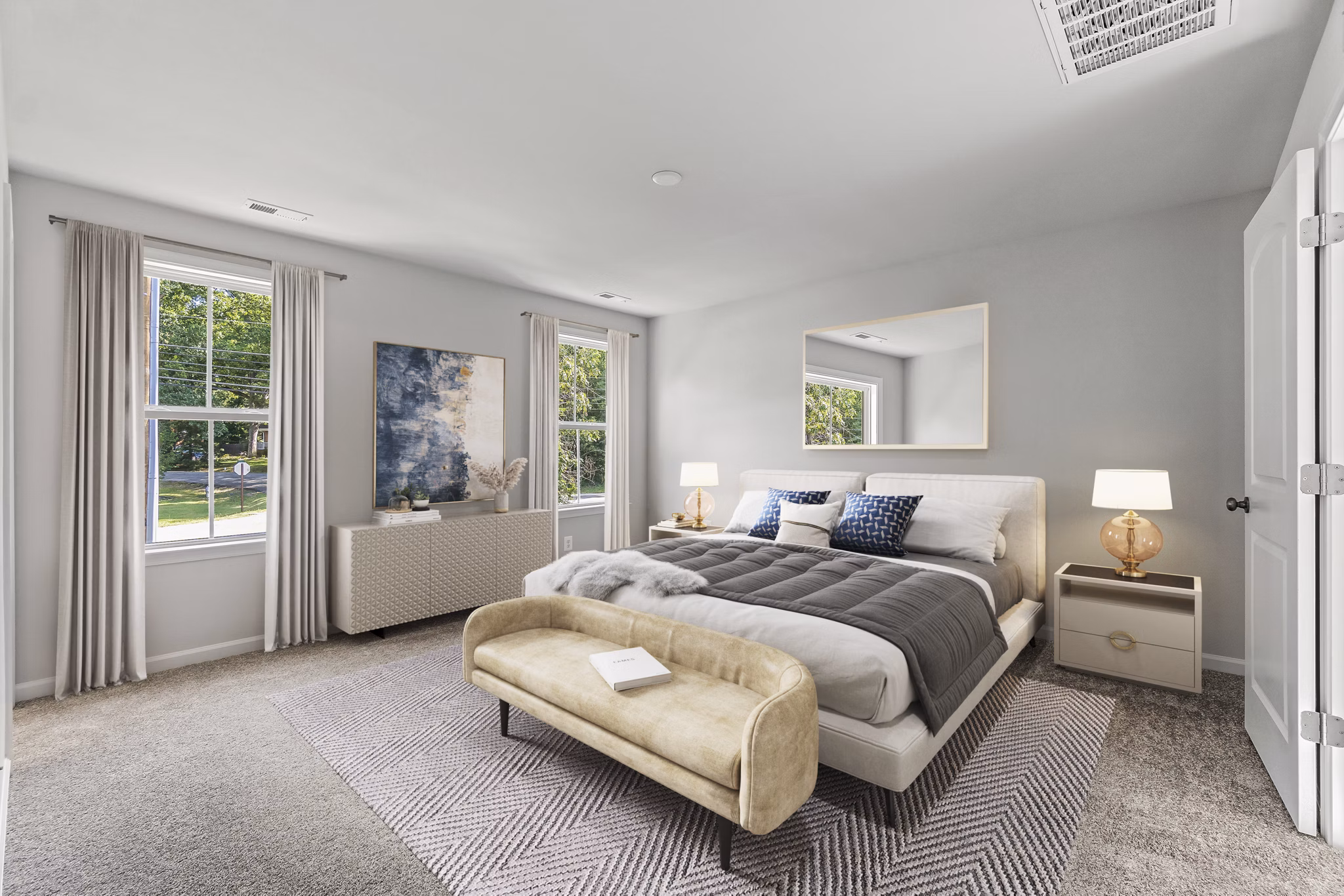 Luxurious bedroom with elegant decor at Brookestone Townhomes, featuring stylish furnishings and ample natural light
