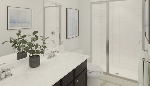 Modern bathroom with marble countertops in Brookestone Townhomes