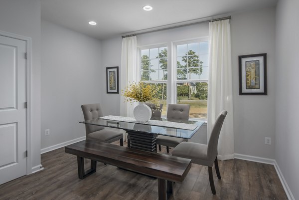 Dining area featuring elegant decor and modern furnishings at Brookestone Townhomes