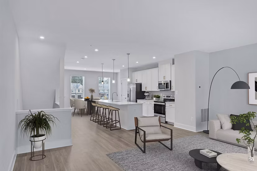 Kitchen with granite countertops and stainless steel appliances in Brookestone Townhomes luxury apartments