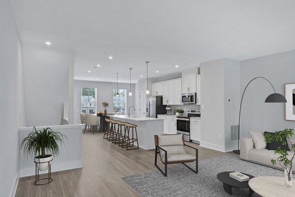 Kitchen with granite countertops and stainless steel appliances in Brookestone Townhomes luxury apartments