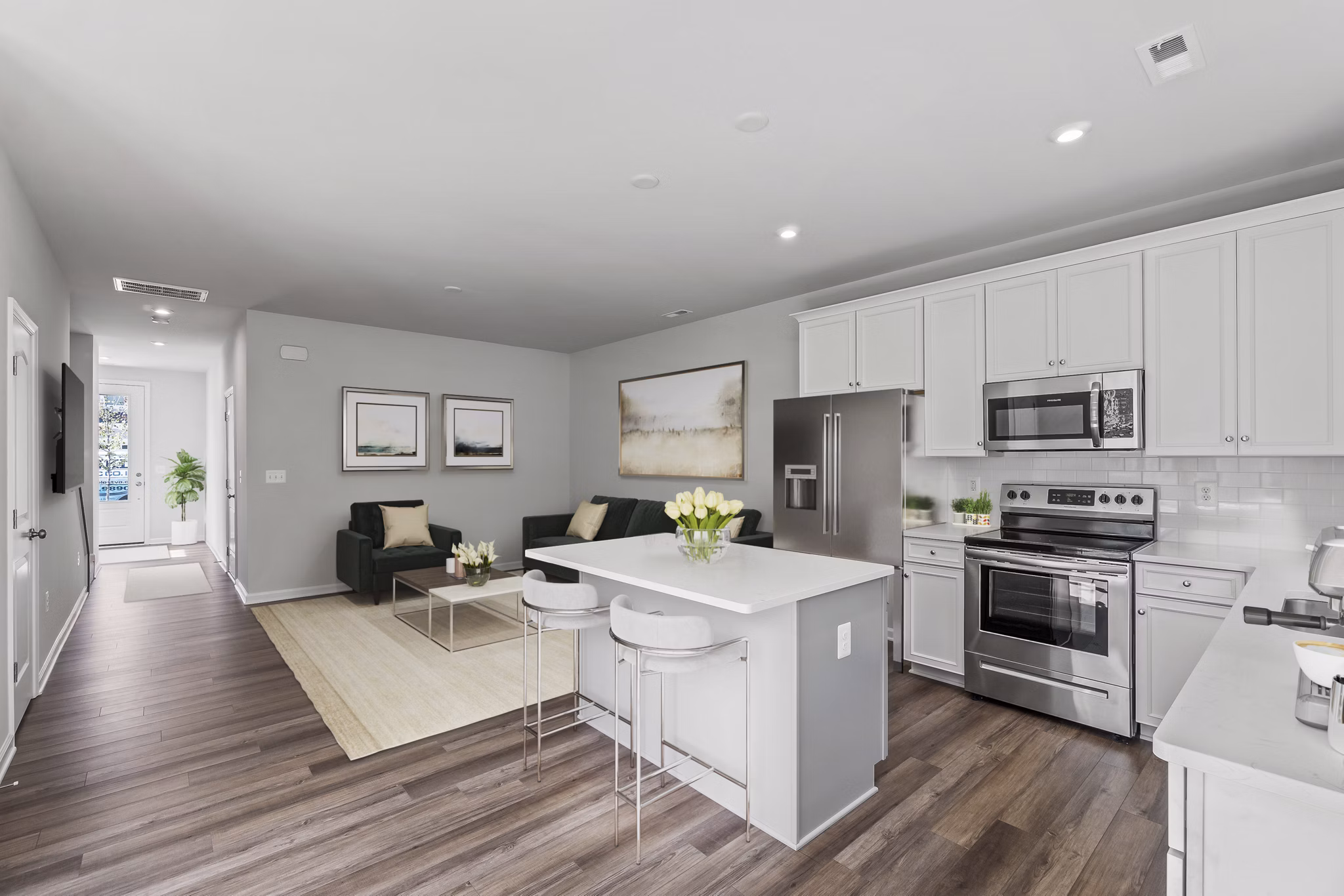 Modern kitchen with stainless steel appliances in Brookestone Townhomes