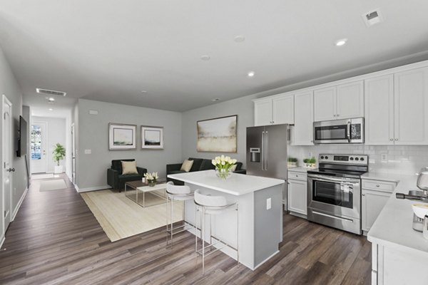 Modern kitchen with stainless steel appliances in Brookestone Townhomes