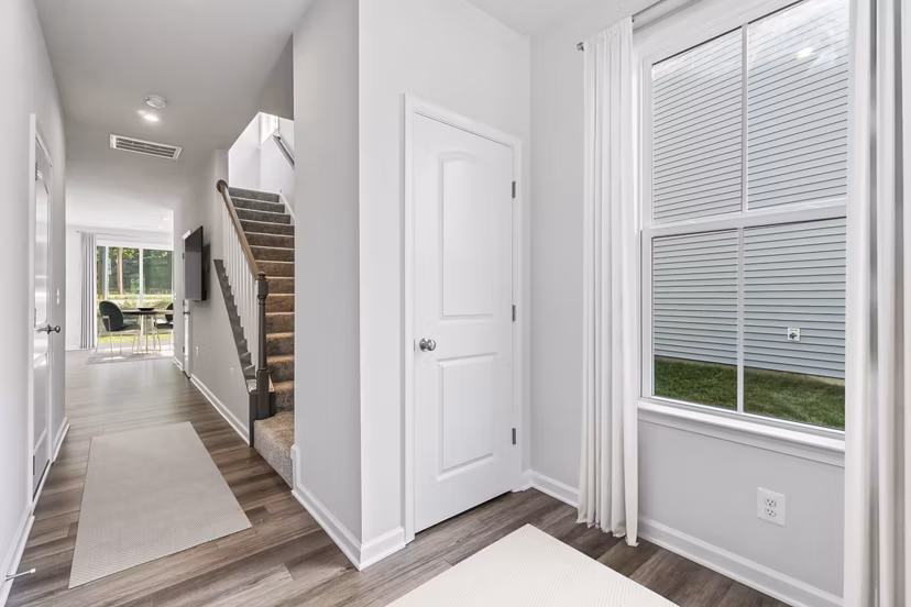 Modern kitchen with granite countertops and stainless steel appliances in Brookestone Townhomes