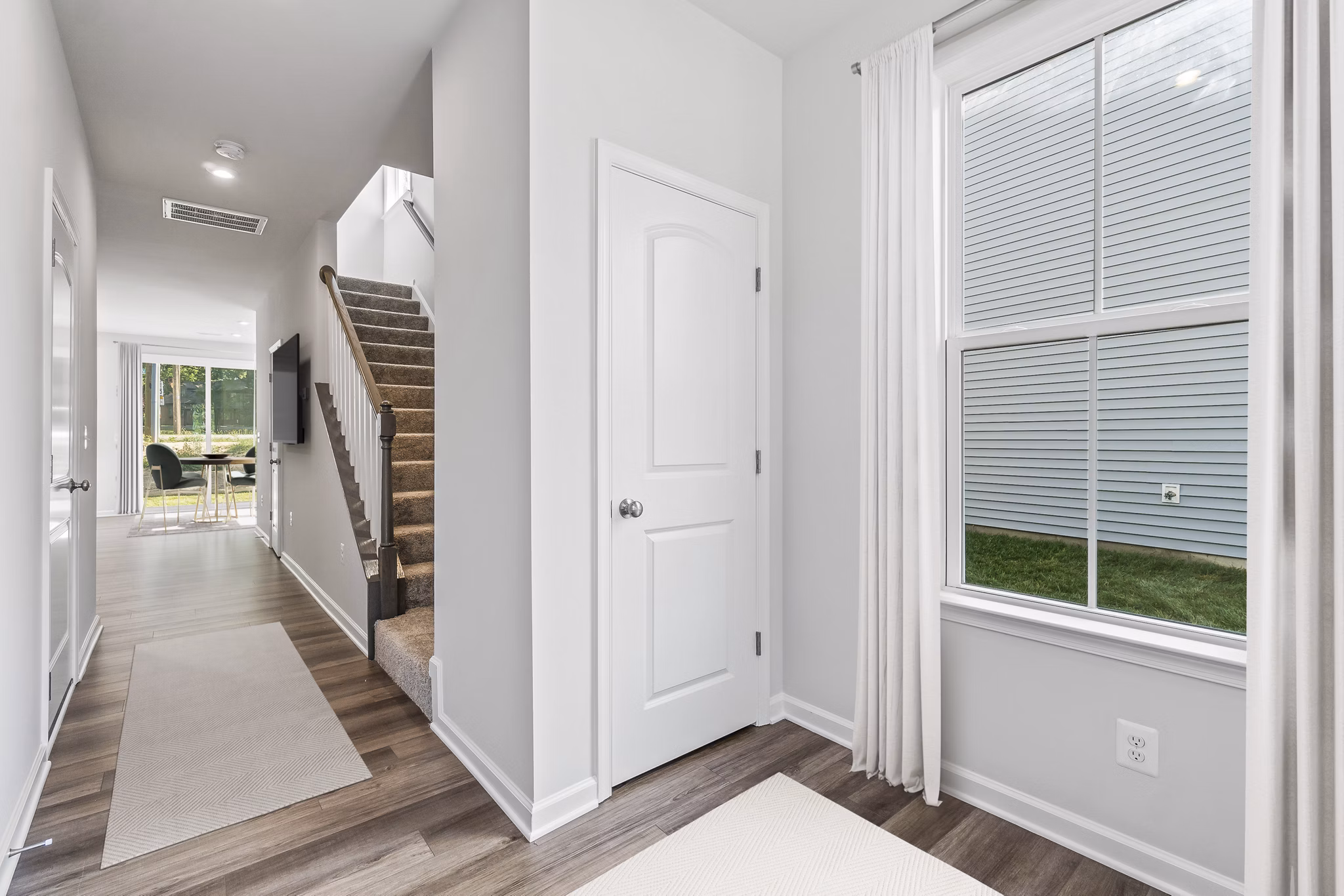 Modern kitchen with granite countertops and stainless steel appliances in Brookestone Townhomes