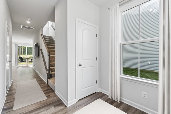 Modern kitchen with granite countertops and stainless steel appliances in Brookestone Townhomes