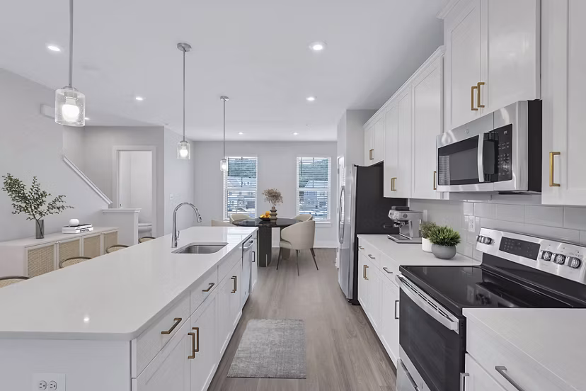 Kitchens featuring modern appliances and granite countertops at Brookestone Townhomes, luxury living by Greystar