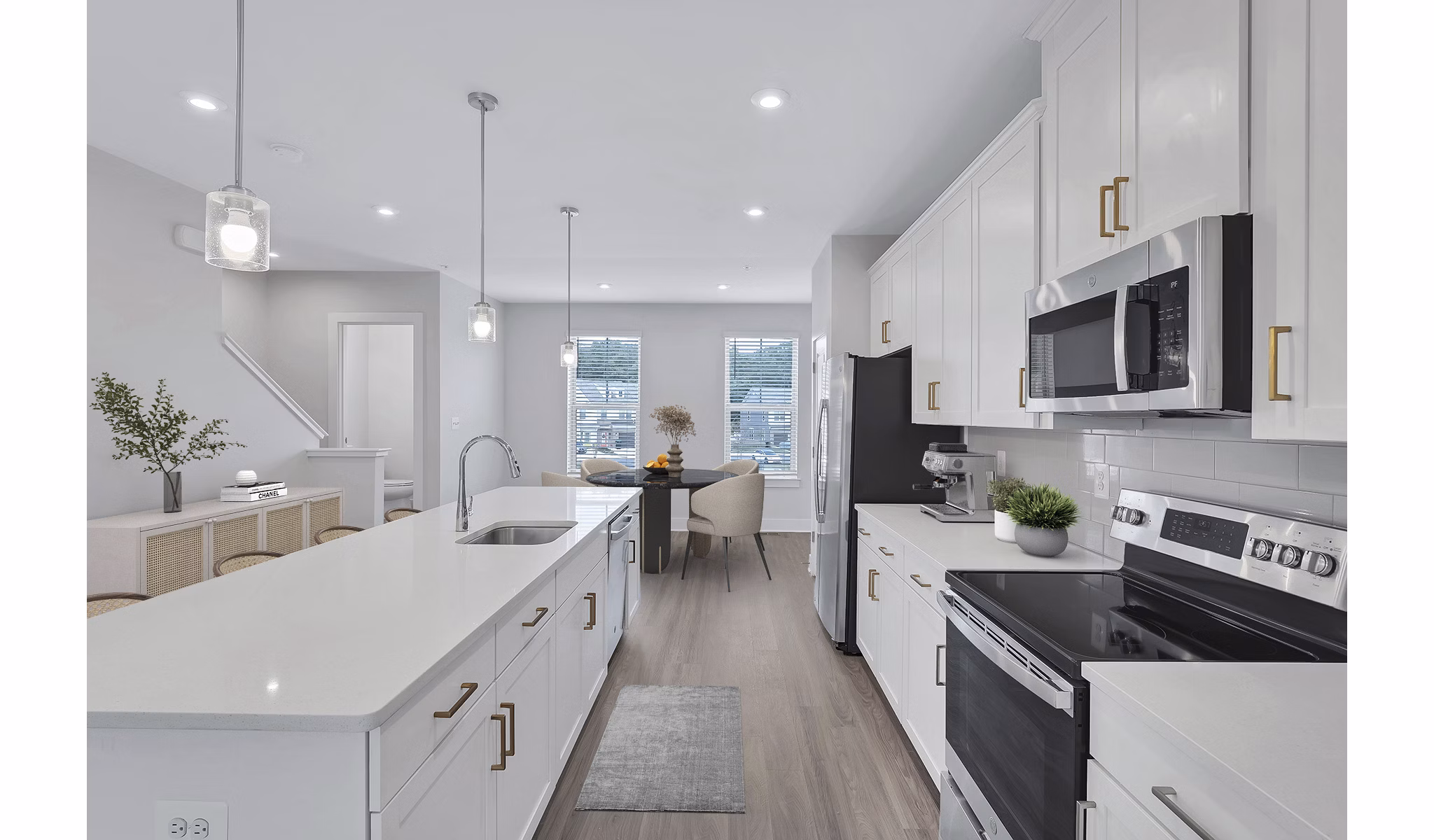 Kitchens featuring modern appliances and granite countertops at Brookestone Townhomes, luxury living by Greystar