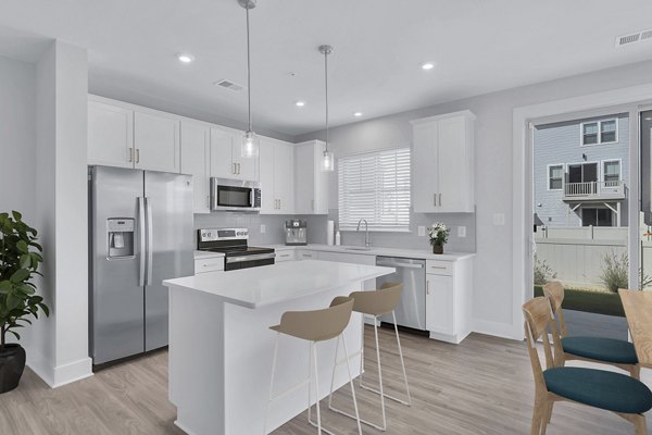 Modern kitchen with stainless steel appliances at Brookestone Townhomes
