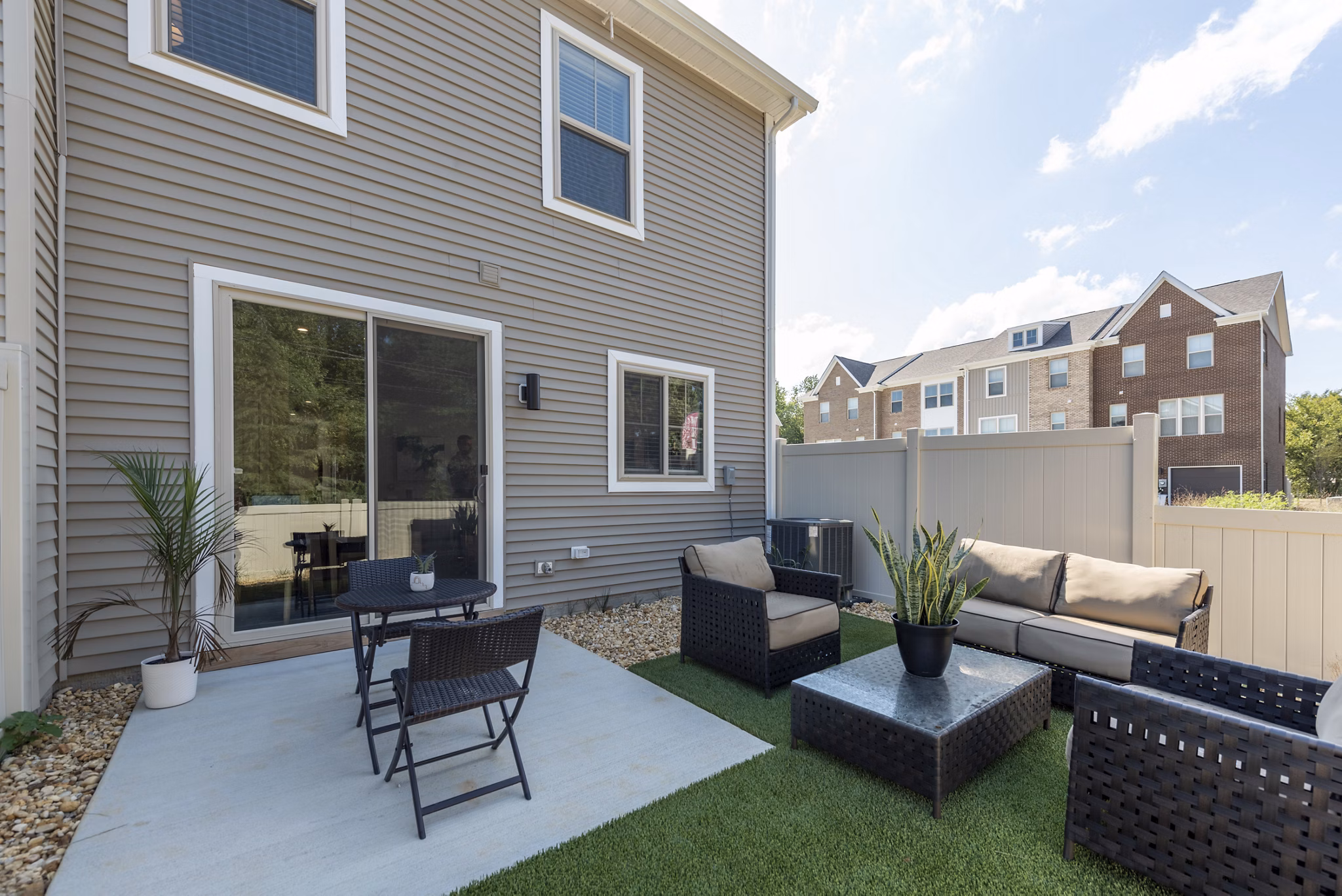 Outdoor patio area with stylish seating at Brookestone Townhomes