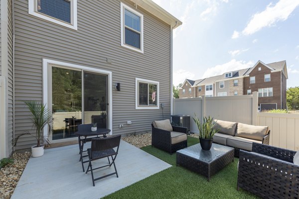 Outdoor patio area with stylish seating at Brookestone Townhomes