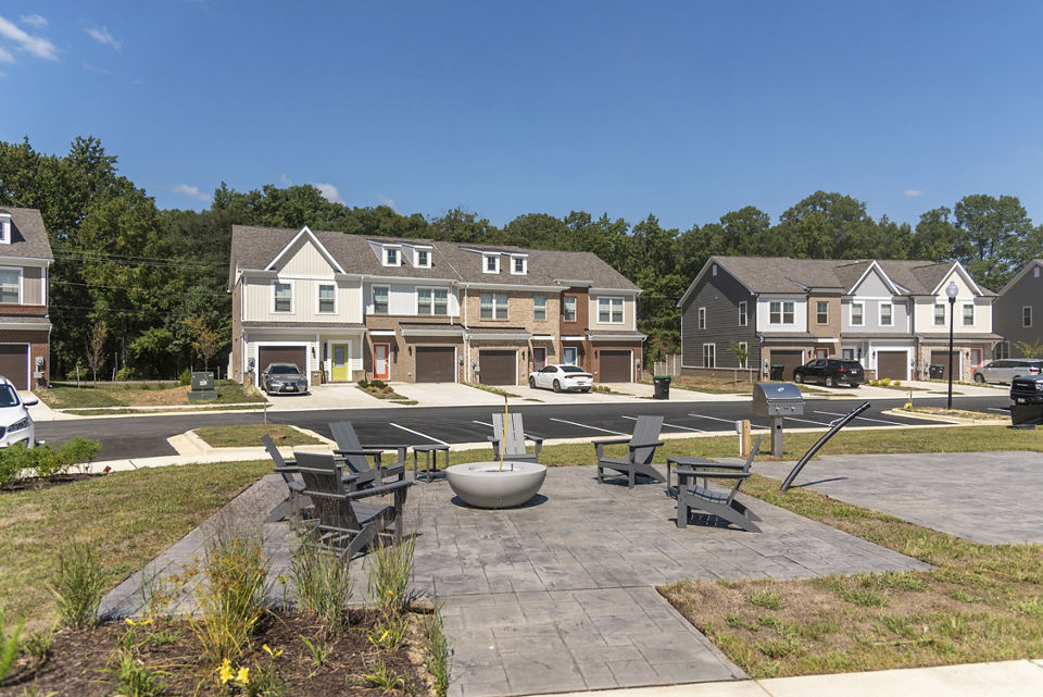 Cozy outdoor seating with a fire pit at Brookestone Townhomes