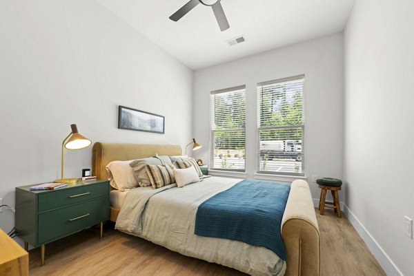 Cozy bedroom with modern decor at NOVEL Morrisville Apartments