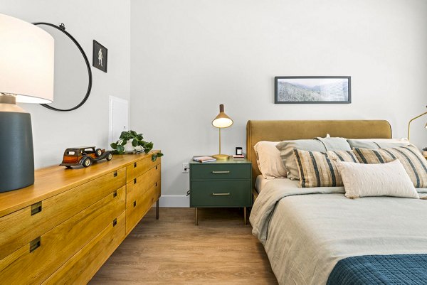 Spacious bedroom with modern decor at NOVEL Morrisville Apartments, offering luxury living