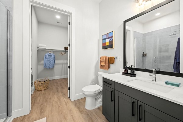 Modern bathroom featuring sleek fixtures and elegant tilework at NOVEL Morrisville Apartments