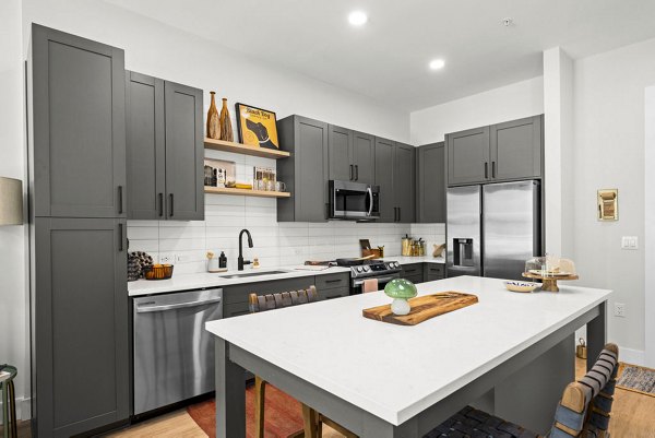 Kitchens with modern appliances in NOVEL Morrisville Apartments, offering spacious layouts and elegant cabinetry in a luxury setting
