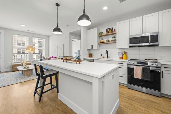Modern kitchen with stainless steel appliances at NOVEL Morrisville Apartments