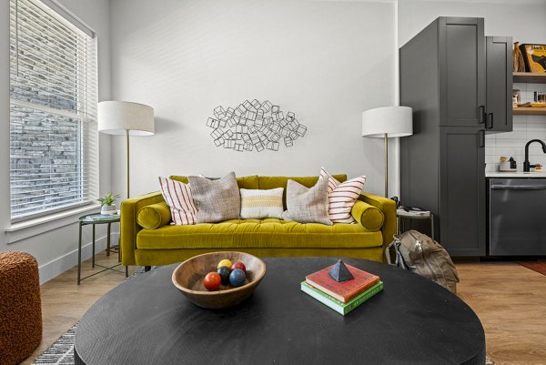 Inviting living room with stylish decor at NOVEL Morrisville Apartments, offering luxury living in an elegant community setting