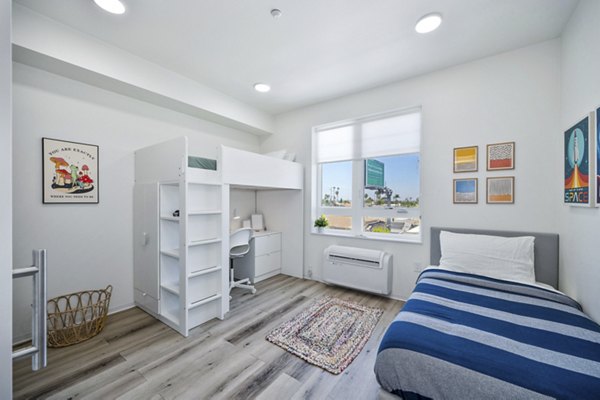 Cozy bedroom with modern design in 2911 Adams Apartments, luxury living by
