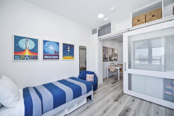 Bedroom featuring modern design and elegant decor in 2911 Adams Apartments